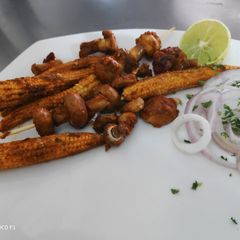 A picture of Tandoori Mushrooms and Babycorn.