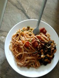 A picture of Spaghetti with beef stew and Vegetables.
