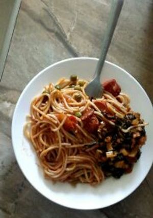 A picture of Spaghetti with beef stew and Vegetables.