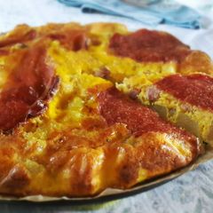 A picture of Oven omelette with potatoes,cheese,ham and salami!.