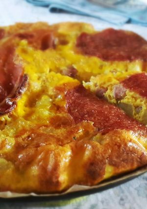 A picture of Oven omelette with potatoes,cheese,ham and salami!.