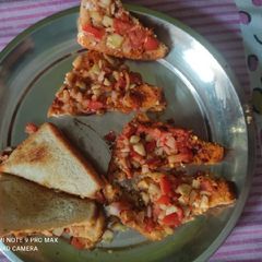 A picture of Veg. sandwich or pizza.