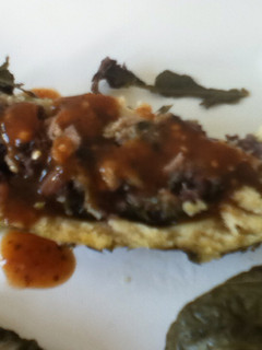 Una foto de Tamal enrollando de huitlacoche, chía, amaranto, cacahuate y hoja santa