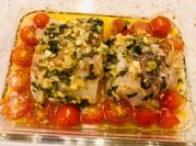 A picture of cherry tomatoes with baked cod
