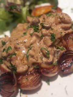 A picture of Grilled Pork Loin with Mushroom Sauce.