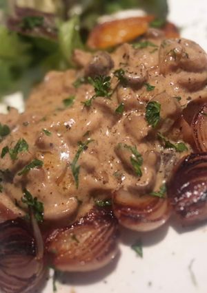 A picture of Grilled Pork Loin with Mushroom Sauce.