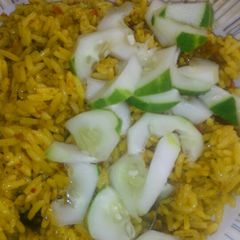 A picture of Yellow jellof and cucumber.
