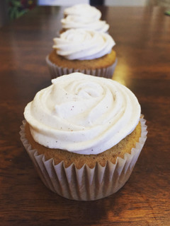 A picture of Pumpkin Cupcakes with Cinnamon Cream Cheese Frosting.