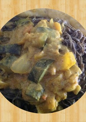 A picture of Veggie Curry over Black Bean Spaghetti.
