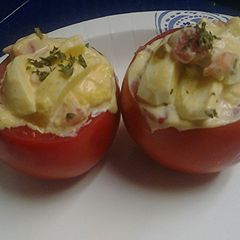 A picture of Spicy Egg salad stuffed tomato.
