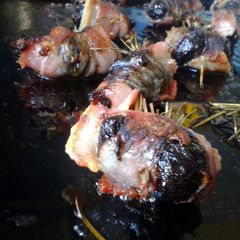 A picture of Devils On Horseback with Rosemary.