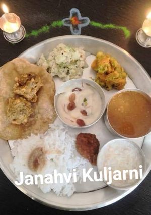 A picture of Shreekhand with dryfruits and Pooris.