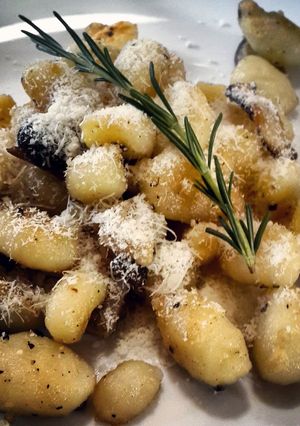 A picture of Potato gnocchi with exotic mushrooms, rosemary and tarragon.