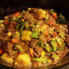 A picture of Beef & Veggies over rice.