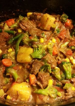 A picture of Beef & Veggies over rice.