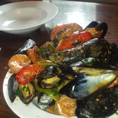 A picture of Mussles in garlic sauce.