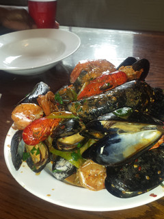 A picture of Mussles in garlic sauce.