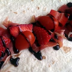 A picture of Sophie's strawberry balsamic cured ham wrap.