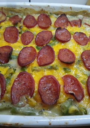 A picture of Green bean and potato casserole with pepperoni and cheese.