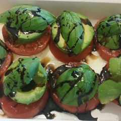 Heirloom Tomato Avocado Caprese Salad A picture of Heirloom Tomato Avocado Caprese Salad.