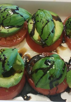 A picture of Heirloom Tomato Avocado Caprese Salad.