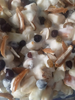 A picture of Fruits & black chickpeas salad with creamy_mayo dressing.