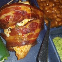 A picture of Bacon wrapped, jalepeno popper chicken.