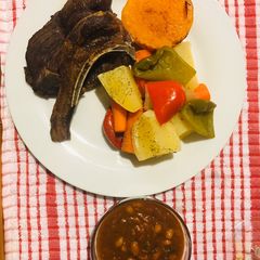 A picture of Veggies and mutton chops.