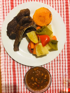 A picture of Veggies and mutton chops.