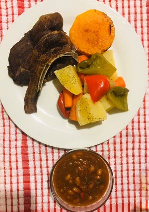 A picture of Veggies and mutton chops.