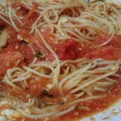 A picture of Spaghetti with herby, garlic roasted tomatoes and feta cheese .