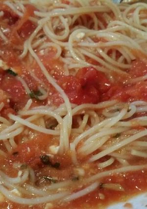 A picture of Spaghetti with herby, garlic roasted tomatoes and feta cheese .