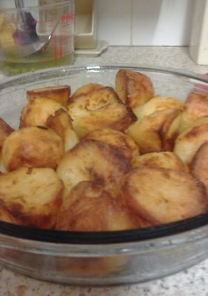 A picture of Lovely crisp, soft and fluffy inside roast potatoes.