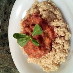 A picture of quinoa with hot tomato sauce.