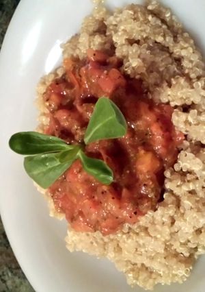 A picture of quinoa with hot tomato sauce.
