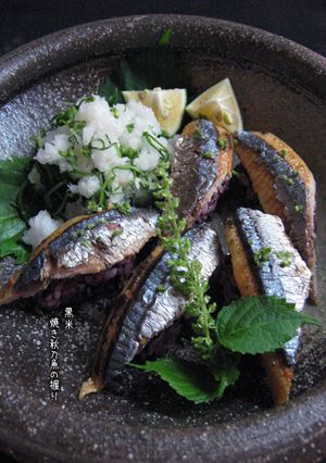 A picture of Grilled Pacific Saury Sushi with Black Rice.