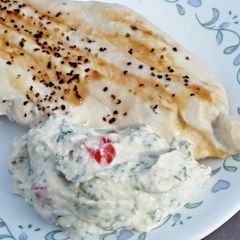 A picture of Grilled Chicken Breasts with Creamy Basil Sauce.