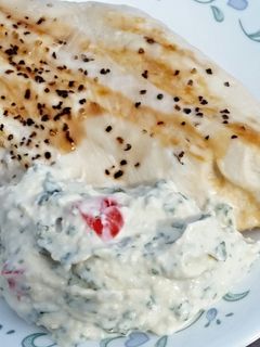 A picture of Grilled Chicken Breasts with Creamy Basil Sauce.