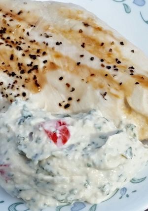A picture of Grilled Chicken Breasts with Creamy Basil Sauce.