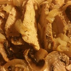 A picture of Mushroom onion pork tenderloin.