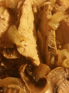 A picture of Mushroom onion pork tenderloin.