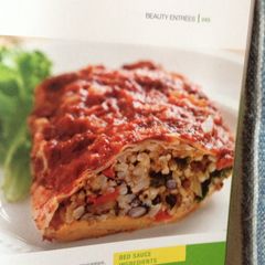A picture of Black Bean Burritos w/ Red Sauce.