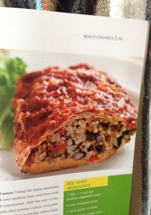 A picture of Black Bean Burritos w/ Red Sauce.