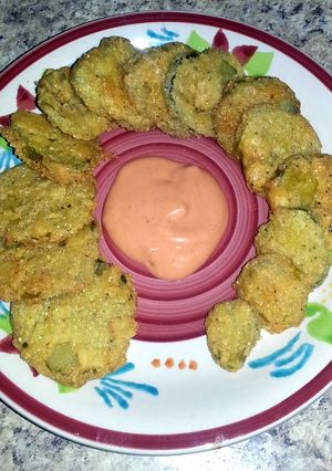 A picture of Gluten Free Fried Pickles w/ Sriracha Dip.