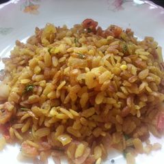 A picture of Poha with red beaten rice (aval/poha).