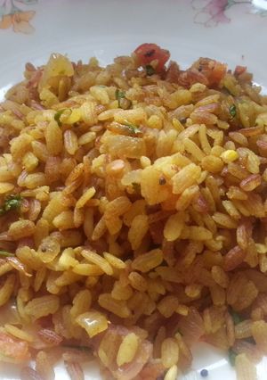 A picture of Poha with red beaten rice (aval/poha).