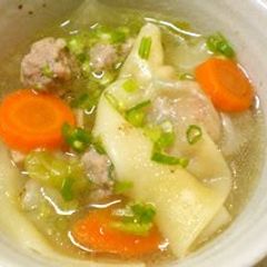 A picture of A Wonton Soup with Plenty of Vegetables.