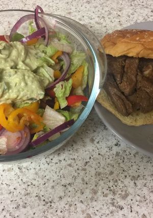 A picture of Garlic Fried Lamb and an Advacado garlic sauce salad.