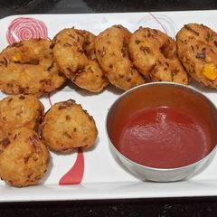 Poha and bread vada A picture of Poha and bread vada.