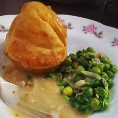 A picture of Buttermilk muffins, garlic peas and shallots in white sauce.